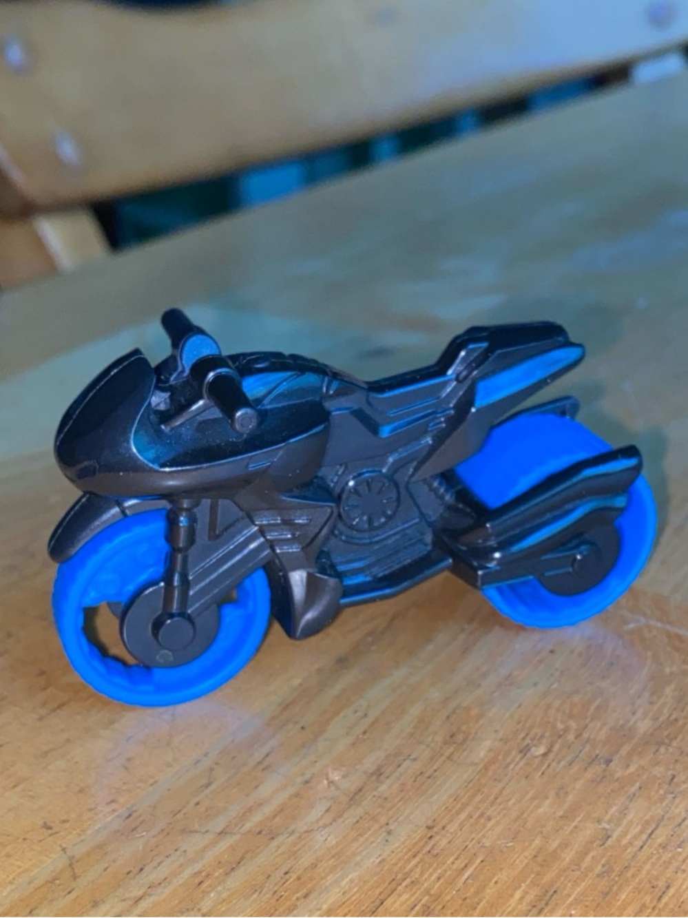 Fisher-Price Imaginext DC Super Friends Bat-Tech Batcycle with blue wheels and